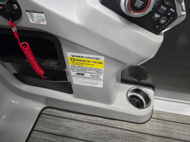 Slide: The Image of 2025 Harris Cruiser 210 boat console with capacity label and controls. - 12