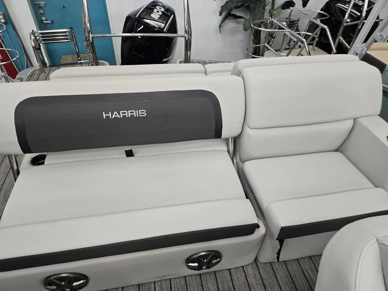 Slide: The Image of 2025 Harris Cruiser 210 boat interior with plush seating and modern design. - 14