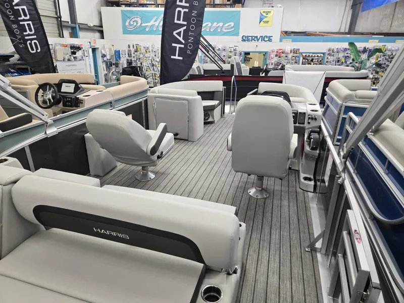 Slide: The Image of 2025 Harris Cruiser 210 pontoon boat interior with plush seating and modern design. - 17