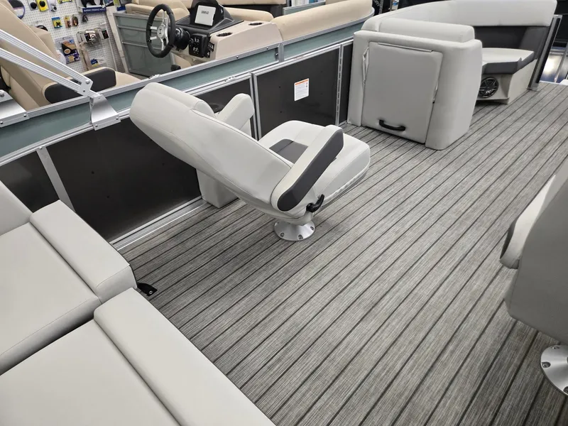 Slide: The Image of 2025 Harris Cruiser 210 interior with modern seating and sleek design. - 18