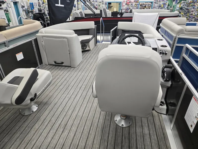 Slide: The Image of 2025 Harris Cruiser 210 boat interior with gray seating and striped flooring. - 19