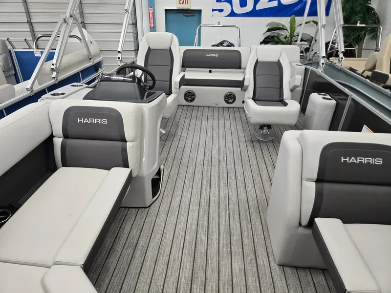 Slide: The Image of 2025 Harris Cruiser 210 pontoon boat interior with gray seating and modern design. - 2