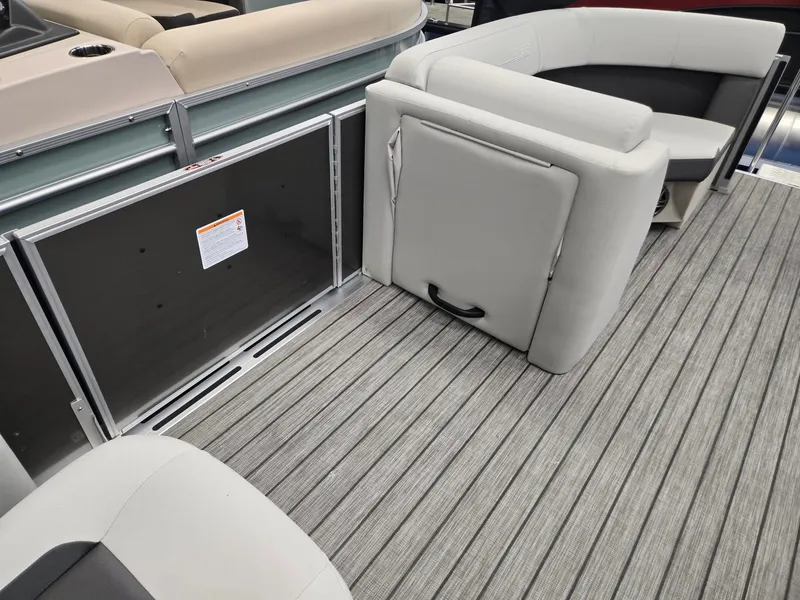 Slide: The Image of 2025 Harris Cruiser 210 interior with gray seating and striped flooring. - 22