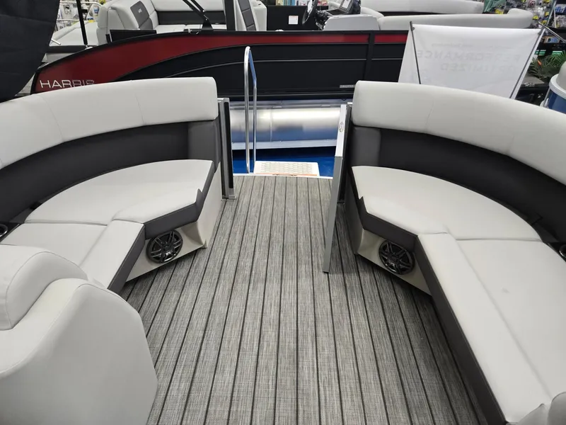 Slide: The Image of 2025 Harris Cruiser 210 pontoon boat with stylish seating and modern flooring. - 23