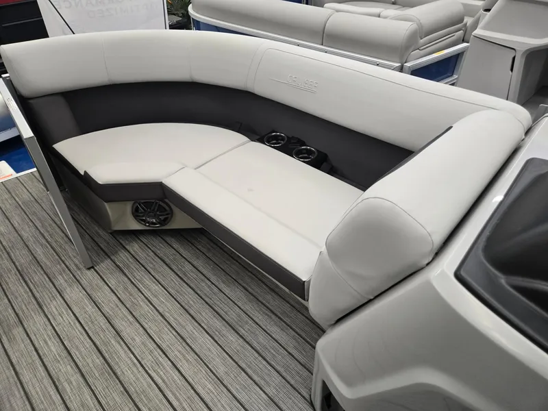 Slide: The Image of 2025 Harris Cruiser 210 boat interior with gray seating and cup holders. - 24