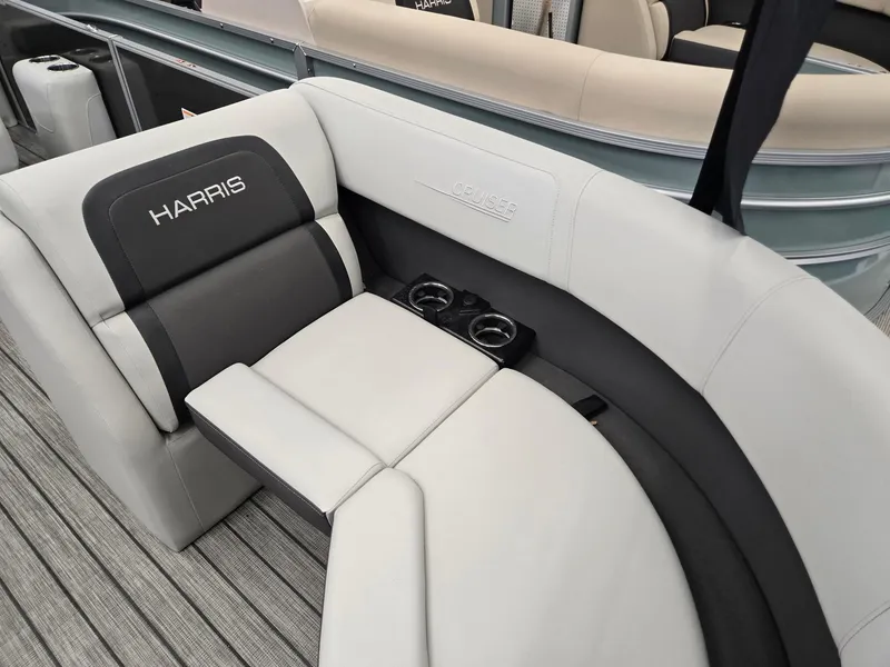 Slide: The Image of 2025 Harris Cruiser 210 boat interior with cushioned seating and cup holders. - 4