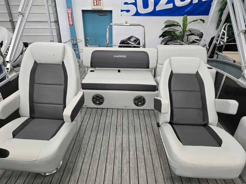 Slide: The Image of 2025 Harris Cruiser 210 boat interior with gray seating and modern design. - 5