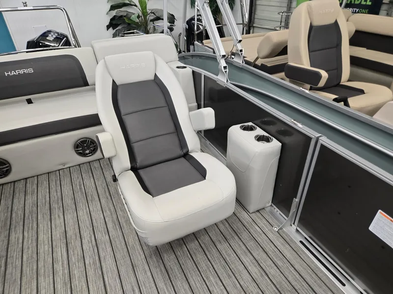 Slide: The Image of 2025 Harris Cruiser 210 boat interior with plush seating and modern design. - 6