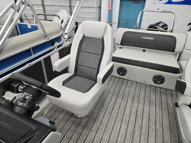 Slide: The Image of 2025 Harris Cruiser 210 interior with modern seating and sleek design. - 7