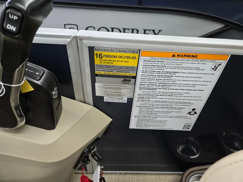 Slide: The Image of Godfrey SWEETWATER 2286 SB boat capacity warning labels, 2025 model. - 12