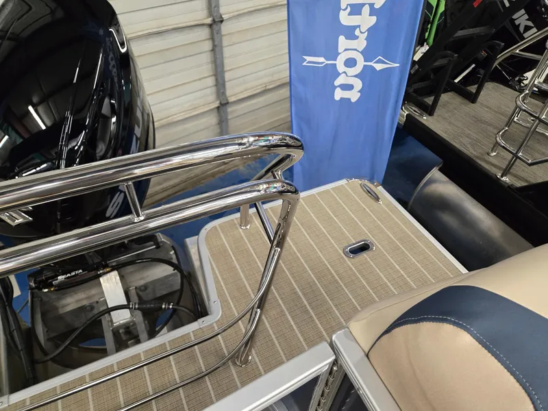 Slide: The Image of 2025 Godfrey SWEETWATER 2286 SB boat deck with railing and motor. - 18