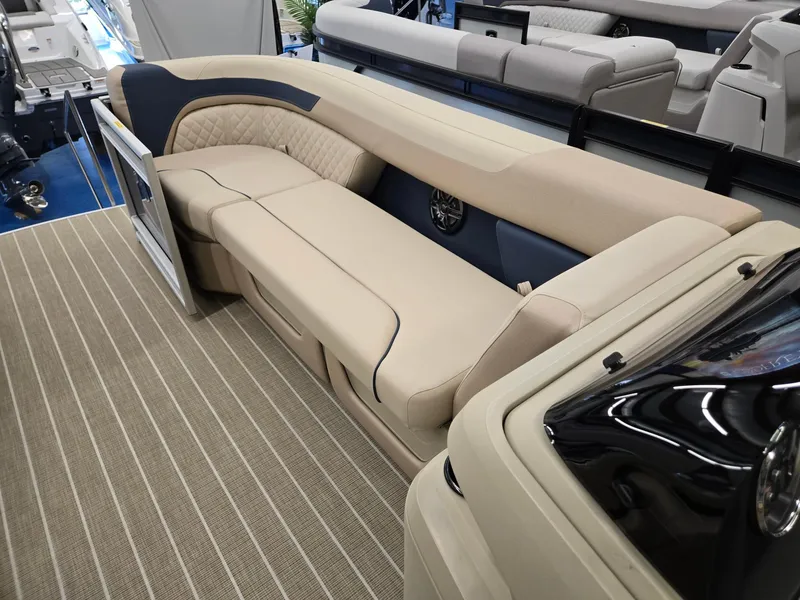 Slide: The Image of 2025 Godfrey SWEETWATER 2286 SB boat interior with beige seating and striped flooring. - 27