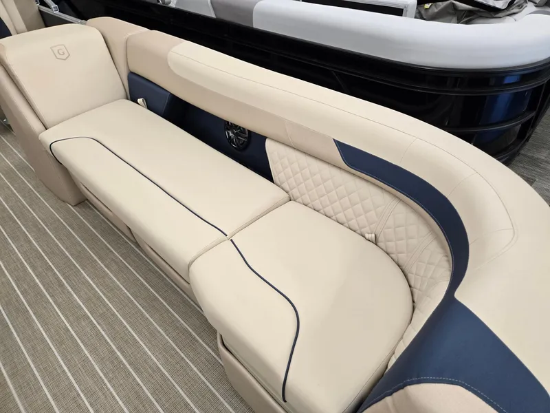 Slide: The Image of Luxurious seating on 2025 Godfrey SWEETWATER 2286 SB pontoon boat, featuring elegant beige and navy design. - 3