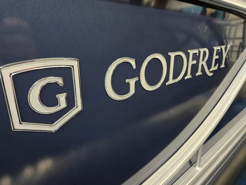 Slide: The Image of Close-up of 2025 Godfrey SWEETWATER 2286 SB logo on blue surface. - 30