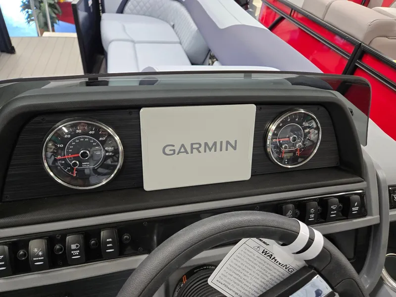 Slide: The Image of Dashboard of 2025 Godfrey SWEETWATER 2286 SFL with Garmin display and gauges. - 11