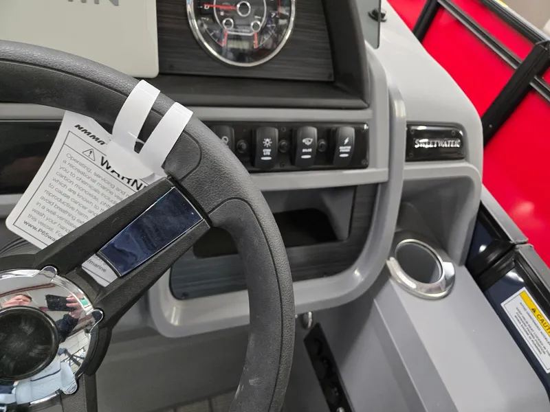 Slide: The Image of Steering wheel and dashboard of 2025 Godfrey SWEETWATER 2286 SFL boat. - 13