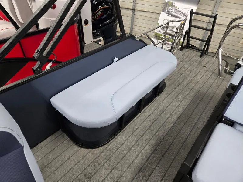 Slide: The Image of 2025 Godfrey SWEETWATER 2286 SFL boat interior with cushioned seating and wooden flooring. - 15
