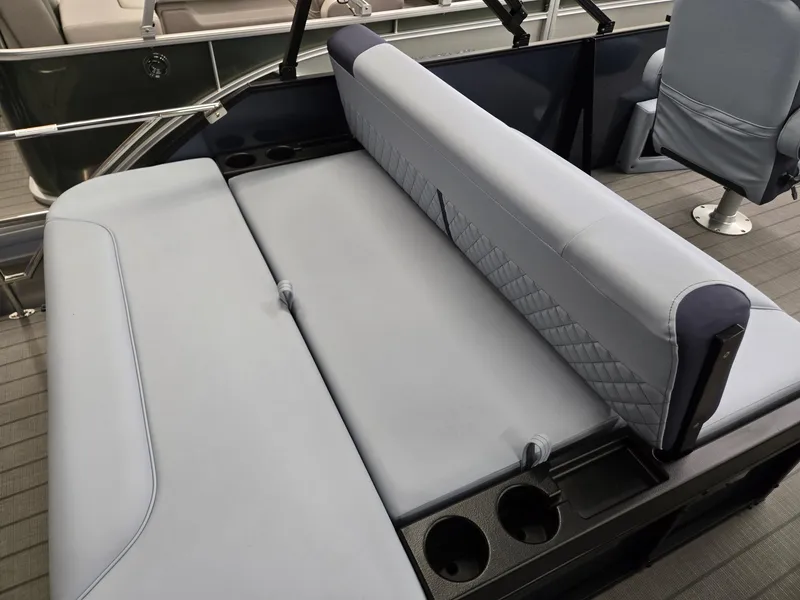 Slide: The Image of 2025 Godfrey SWEETWATER 2286 SFL boat interior with gray seating and cup holders. - 20