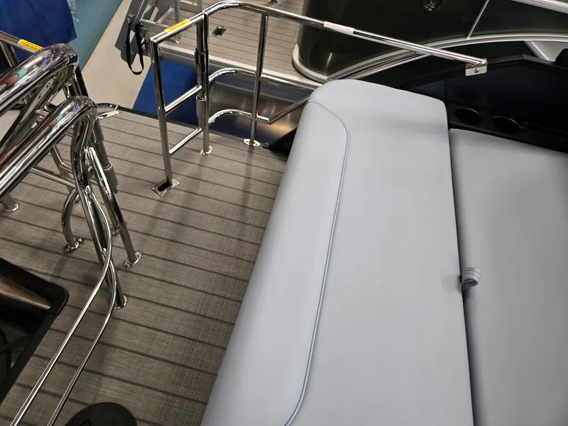 Slide: The Image of 2025 Godfrey SWEETWATER 2286 SFL boat interior with sleek seating and stainless steel railings. - 21
