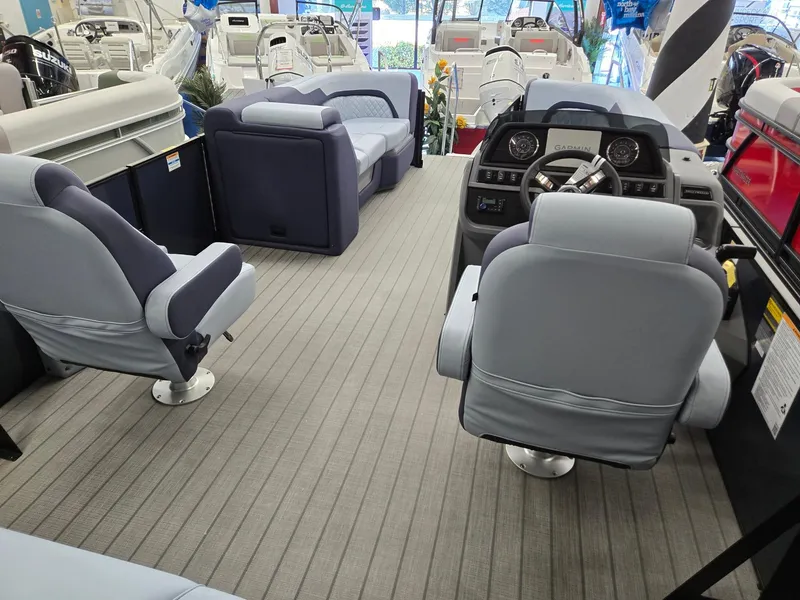 Slide: The Image of Interior of 2025 Godfrey SWEETWATER 2286 SFL pontoon boat with plush seating and modern dashboard. - 22
