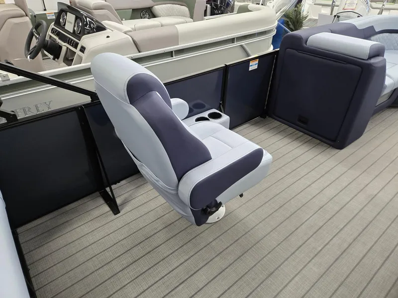 Slide: The Image of 2025 Godfrey SWEETWATER 2286 SFL boat interior with plush seating and modern design. - 23