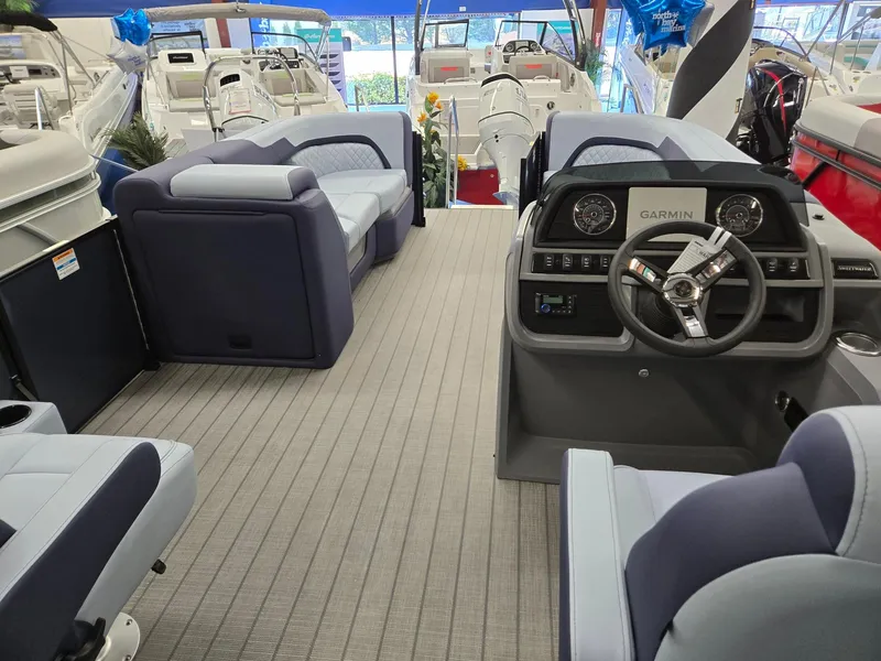 Slide: The Image of Interior of 2025 Godfrey SWEETWATER 2286 SFL pontoon boat with modern seating and steering console. - 24