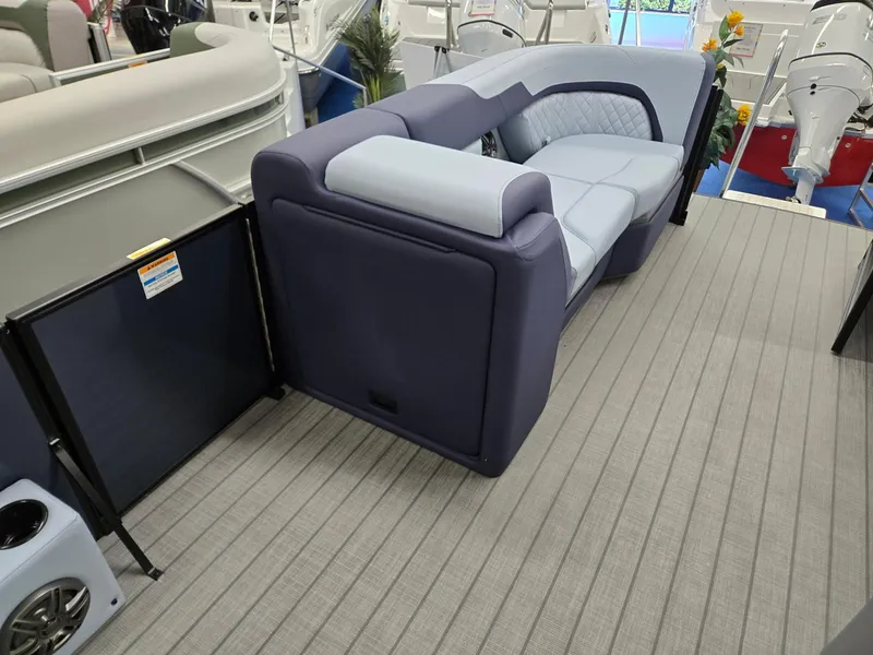 Slide: The Image of 2025 Godfrey SWEETWATER 2286 SFL boat interior with plush seating and modern design. - 26