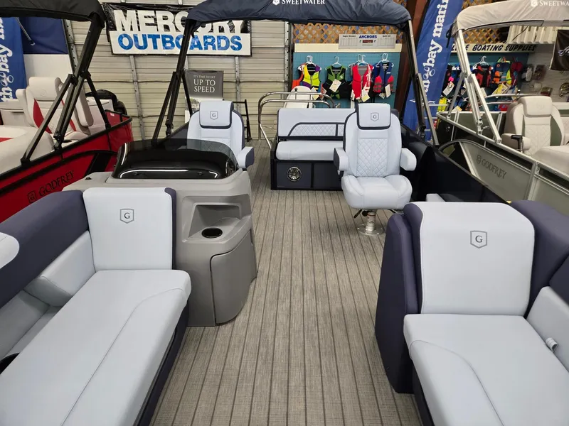 Slide: The Image of 2025 Godfrey SWEETWATER 2286 SFL pontoon boat interior with plush seating. - 3