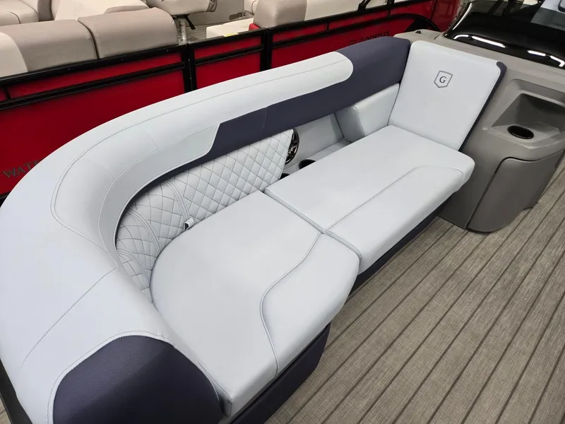 Slide: The Image of 2025 Godfrey SWEETWATER 2286 SFL boat interior with plush seating and modern design. - 4
