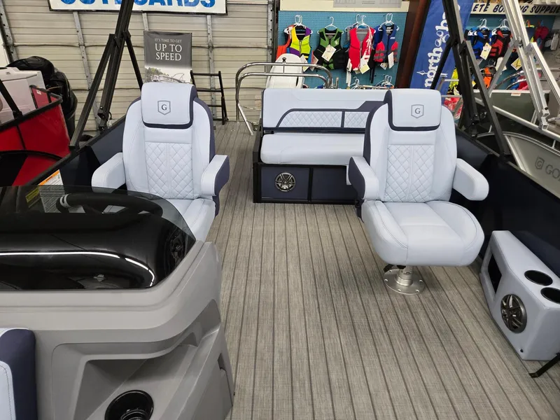 Slide: The Image of 2025 Godfrey SWEETWATER 2286 SFL pontoon boat interior with plush seating and modern design. - 6