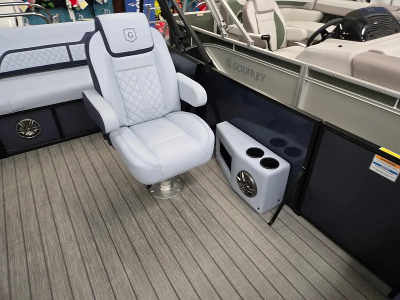 Slide: The Image of 2025 Godfrey SWEETWATER 2286 SFL boat interior with luxury seating and cup holders. - 7