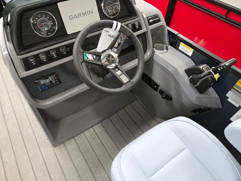 Slide: The Image of 2025 Godfrey SWEETWATER 2286 SFL boat dashboard with Garmin navigation system. - 9