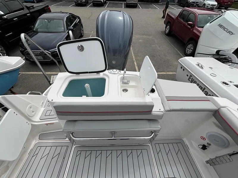 Slide: The Image of 2025 Solara S-250 CW boat with open storage compartment and sleek design. - 11
