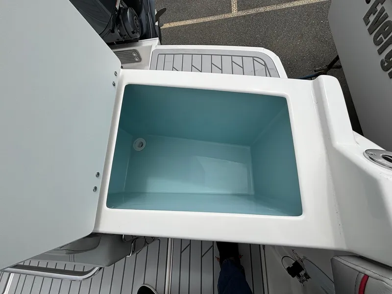 Slide: The Image of Open storage compartment on 2025 Solara S-250 CW boat deck. - 12