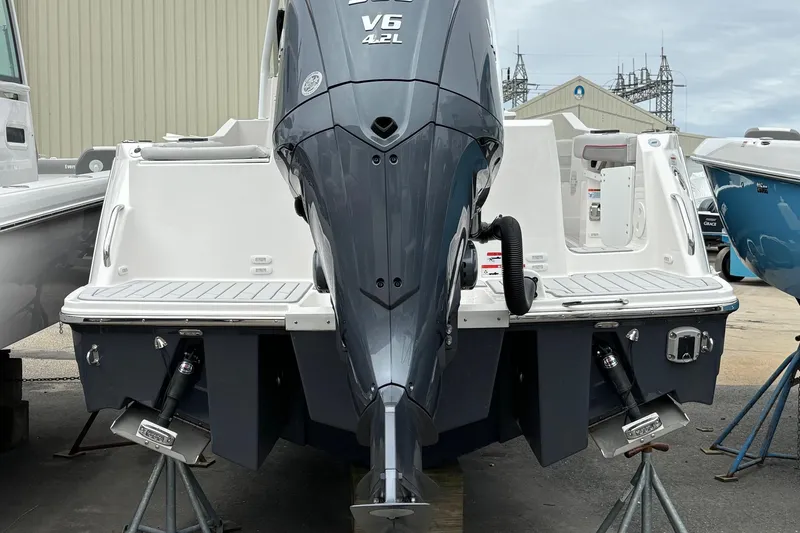 Slide: The Image of 2025 Solara S-250 CW boat with V6 engine, displayed on stands. - 14