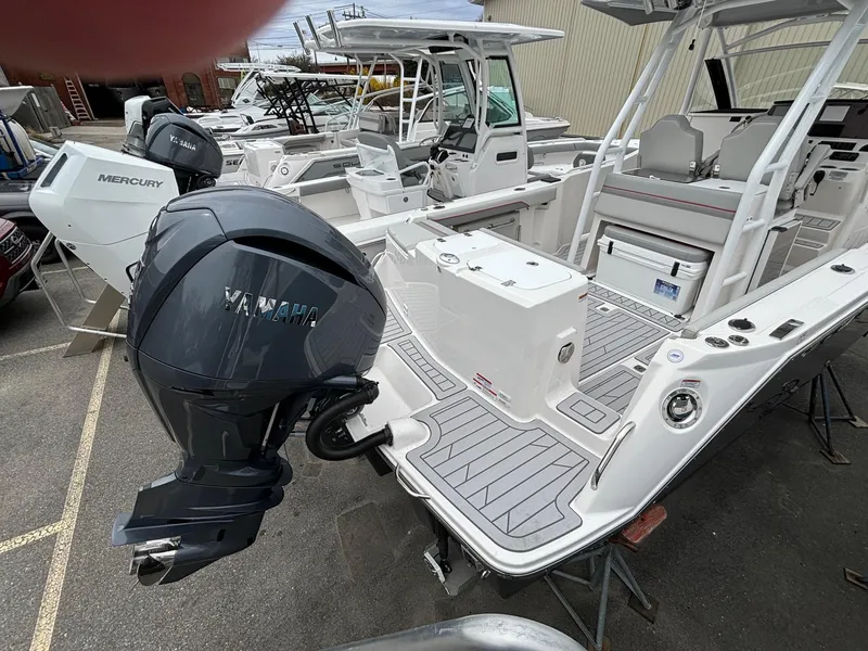 Slide: The Image of Solara S-250 CW 2025 boat with Yamaha outboard motor in a marina setting. - 2