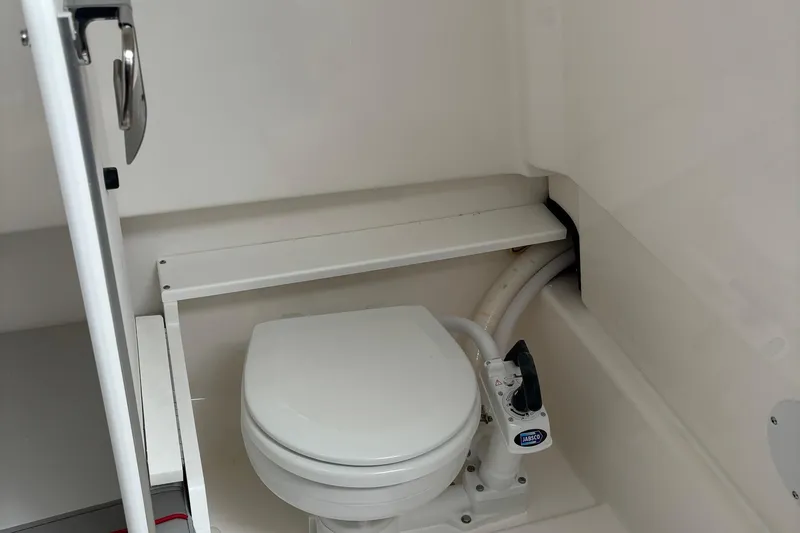 Slide: The Image of Compact marine toilet in 2025 Solara S-250 CW boat bathroom. - 20
