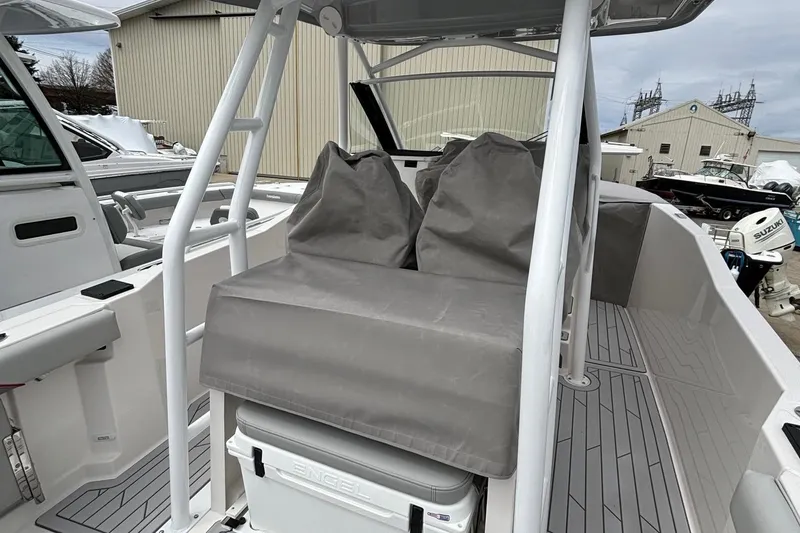 Slide: The Image of 2025 Solara S-250 CW boat interior with cushioned seating and storage. - 23