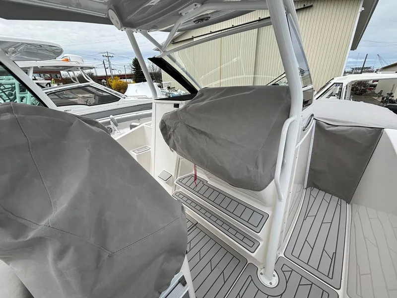 Slide: The Image of 2025 Solara S-250 CW boat interior with covered seats and modern design. - 25