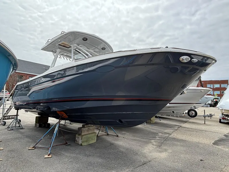Slide: The Image of 2025 Solara S-250 CW boat on display, sleek design, elevated on stands. - 3