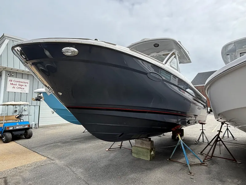 Slide: The Image of 2025 Solara S-250 CW boat on stands in a marina. - 4