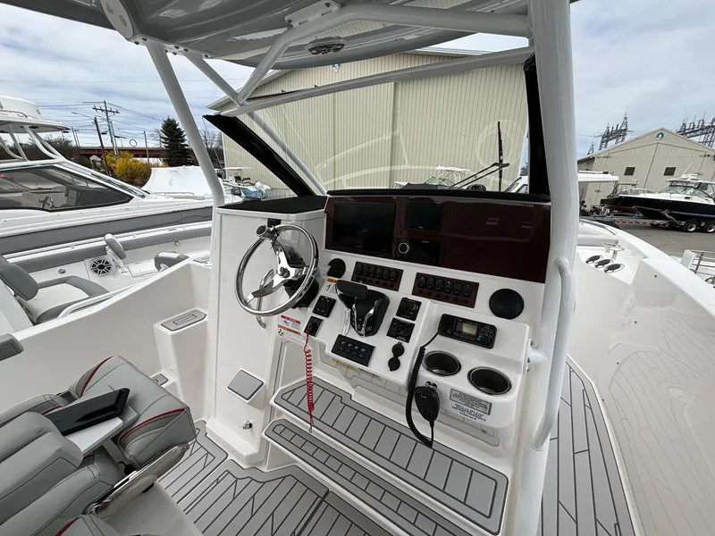 Slide: The Image of 2025 Solara S-250 CW boat cockpit with modern controls and steering wheel. - 7