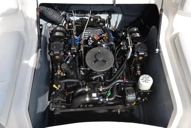Slide: The Image of 2006 Bayliner 249 SD engine compartment, showcasing detailed mechanical components. - 24