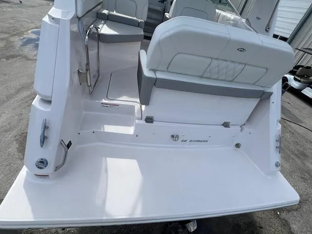 Slide: The Image of 2019 Regal 26 Express boat interior, featuring white seating and sleek design. - 4