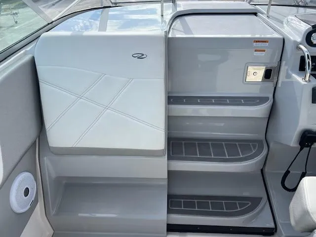 Slide: The Image of 2019 Regal 26 Express boat interior with sleek gray and white design. - 8