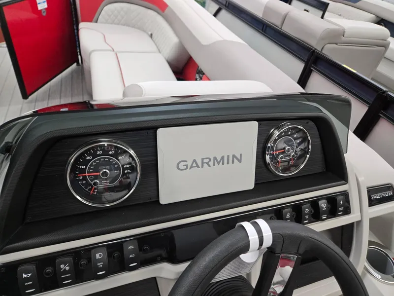 Slide: The Image of 2025 Godfrey Sweetwater 2286 FS dashboard with Garmin display and steering wheel. - 10