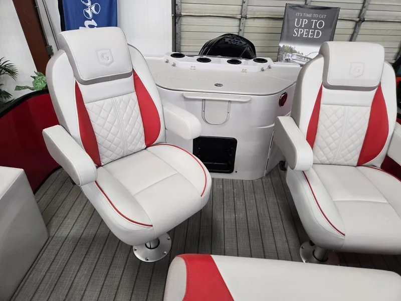 Slide: The Image of Luxury seating on 2025 Godfrey Sweetwater 2286 FS boat, featuring white and red upholstery. - 16
