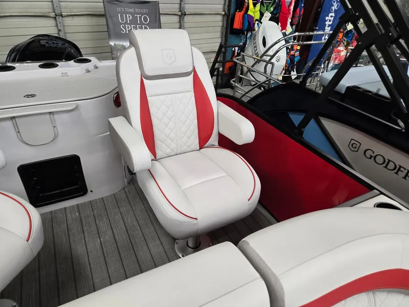 Slide: The Image of 2025 Godfrey Sweetwater 2286 FS boat interior with white and red seating. - 17
