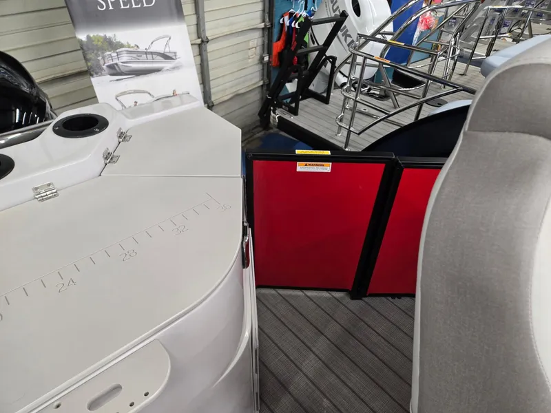 Slide: The Image of 2025 Godfrey Sweetwater 2286 FS boat interior with seating and equipment display. - 19