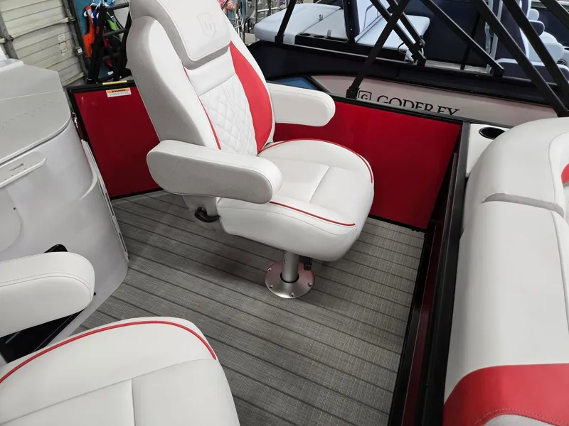 Slide: The Image of 2025 Godfrey Sweetwater 2286 FS boat interior with white and red seating. - 22
